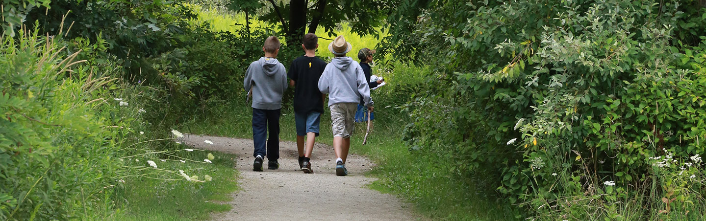 young boys hike nature trails at Kortright Centre for Conservation