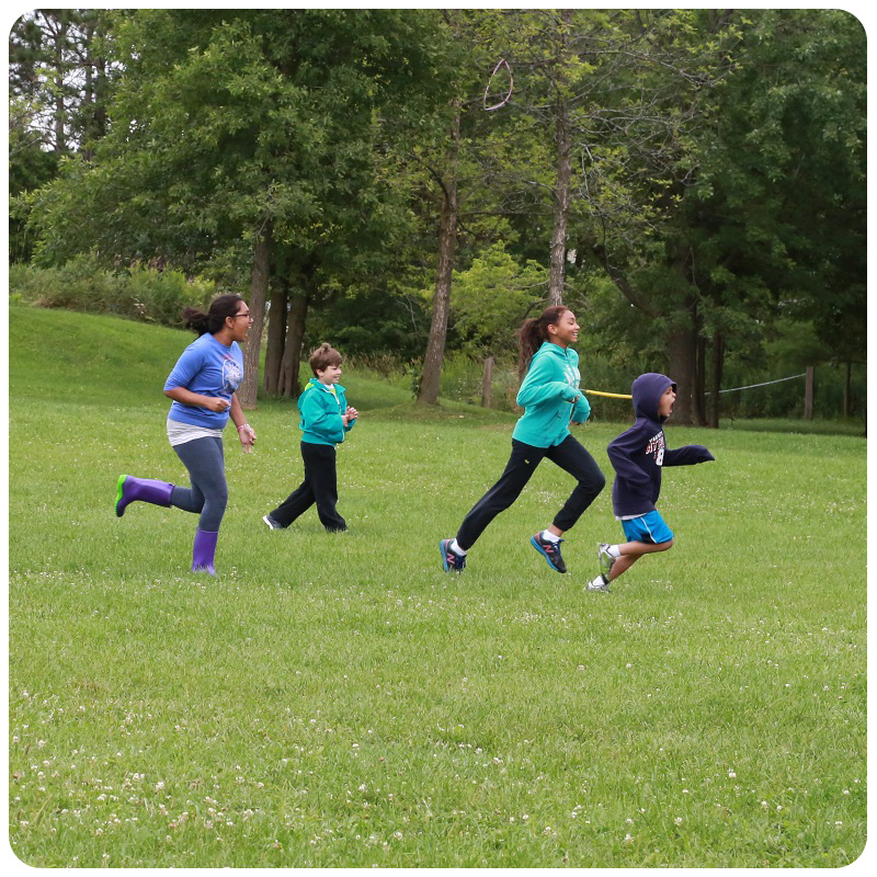 kids running in field at Kortright Centre