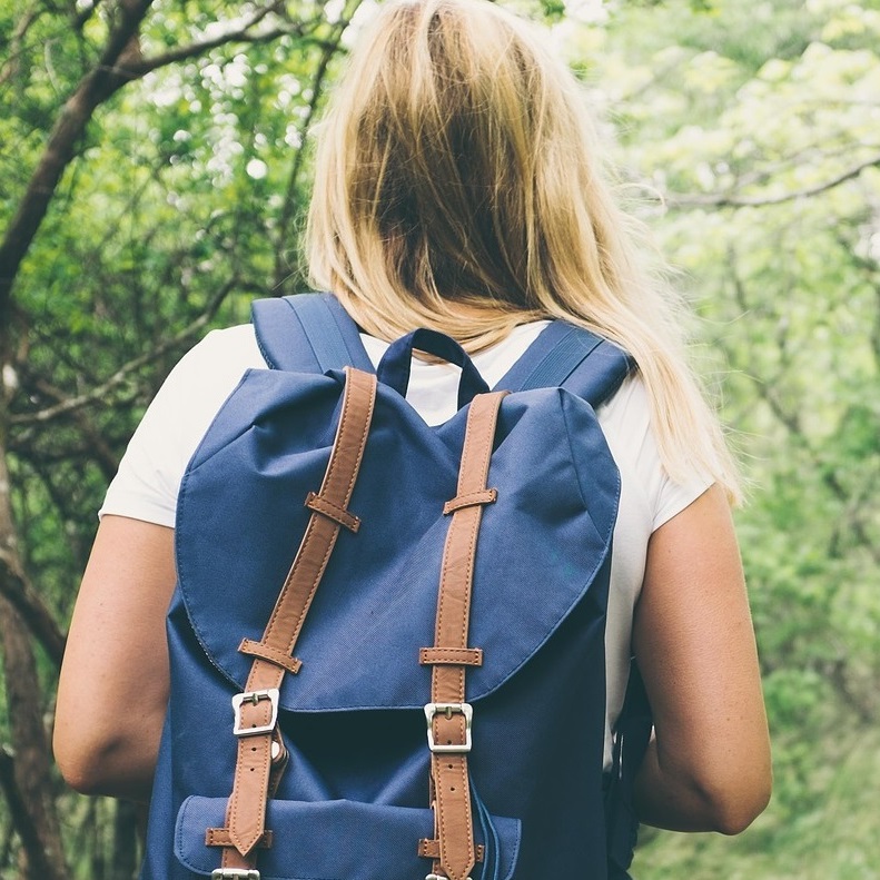 young woman takes part in outdoor wellness retreat at Kortright Centre for Conservation