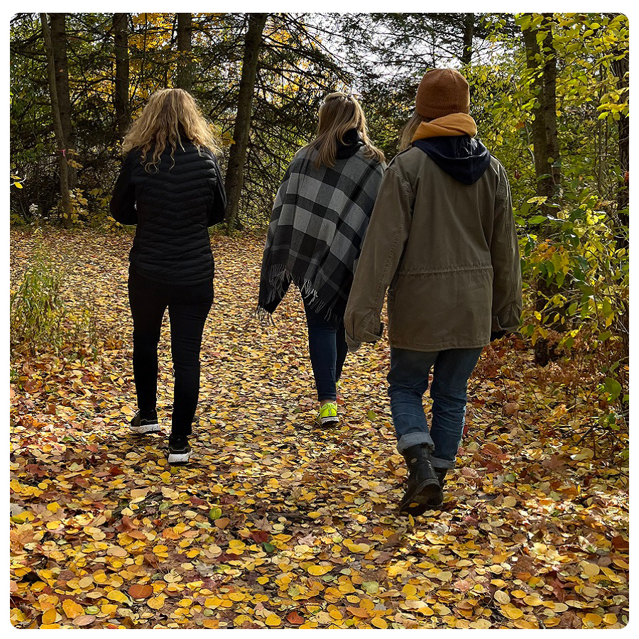 hikers explore a trail at the Kortright Centre for Conservation